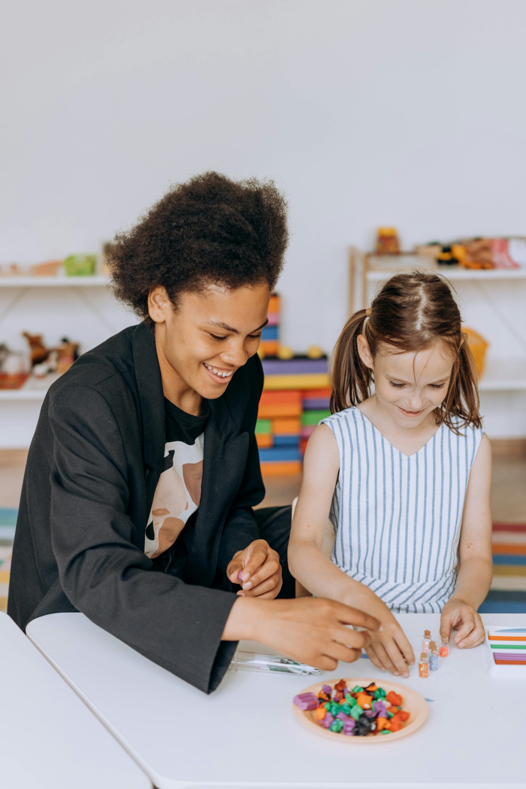 Image showing a child and therapist in an occupational therapy session, focusing on co-regulation and creating a safe, supportive environment for sensory processing.