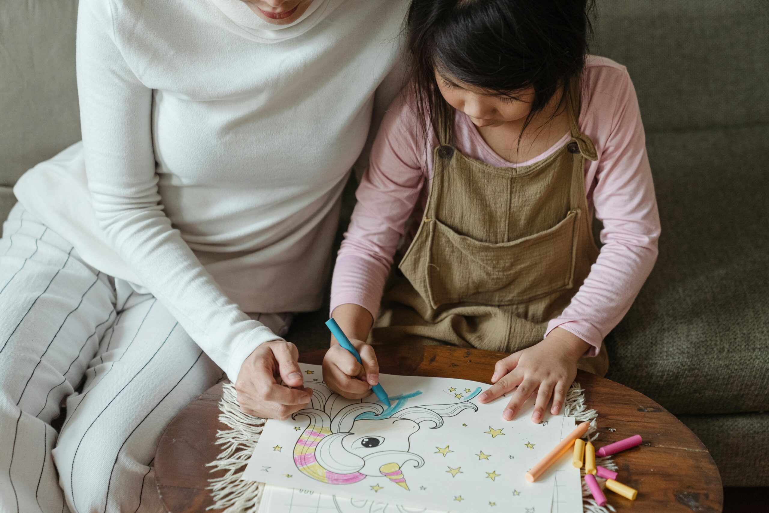 A warm, neuroaffirming illustration of a parent and child collaborating at home, showcasing the connection-first approach to boundary setting for PDA children.